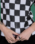 Checker Organic Tee in Black close up on Alex