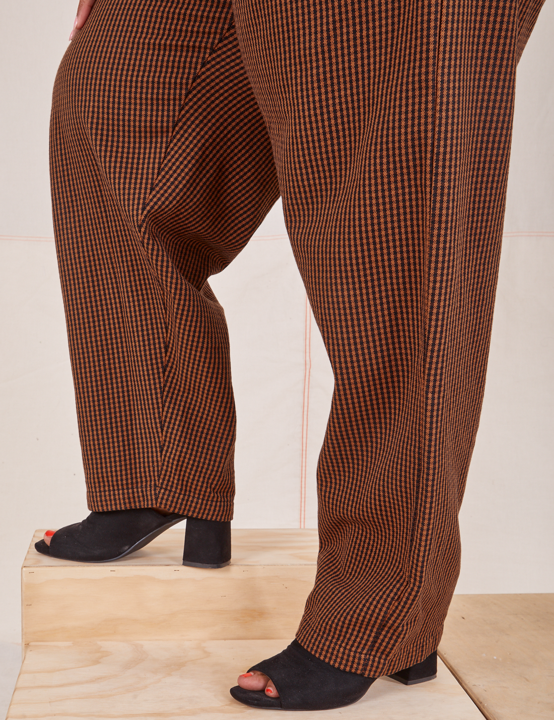Side view pant leg close up of Checker Trousers in Brown
