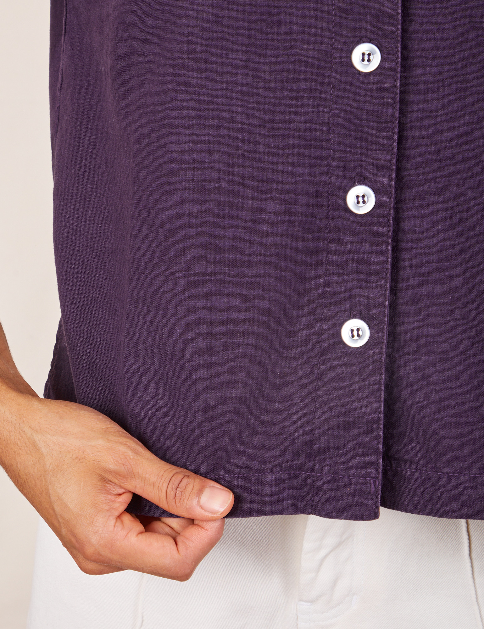 Bottom hem close up of Pantry Button-Up in Nebula Purple worn by Jesse