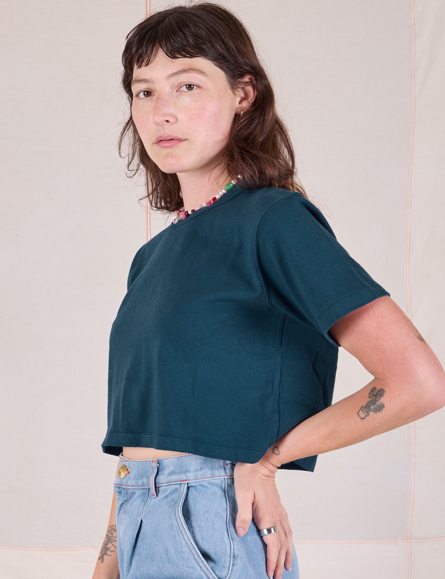 Cropped Burly Tee in Lagoon side view on Alex