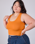 Angled front view of Cropped Tank Top in Creamsicle Orange on Ashley