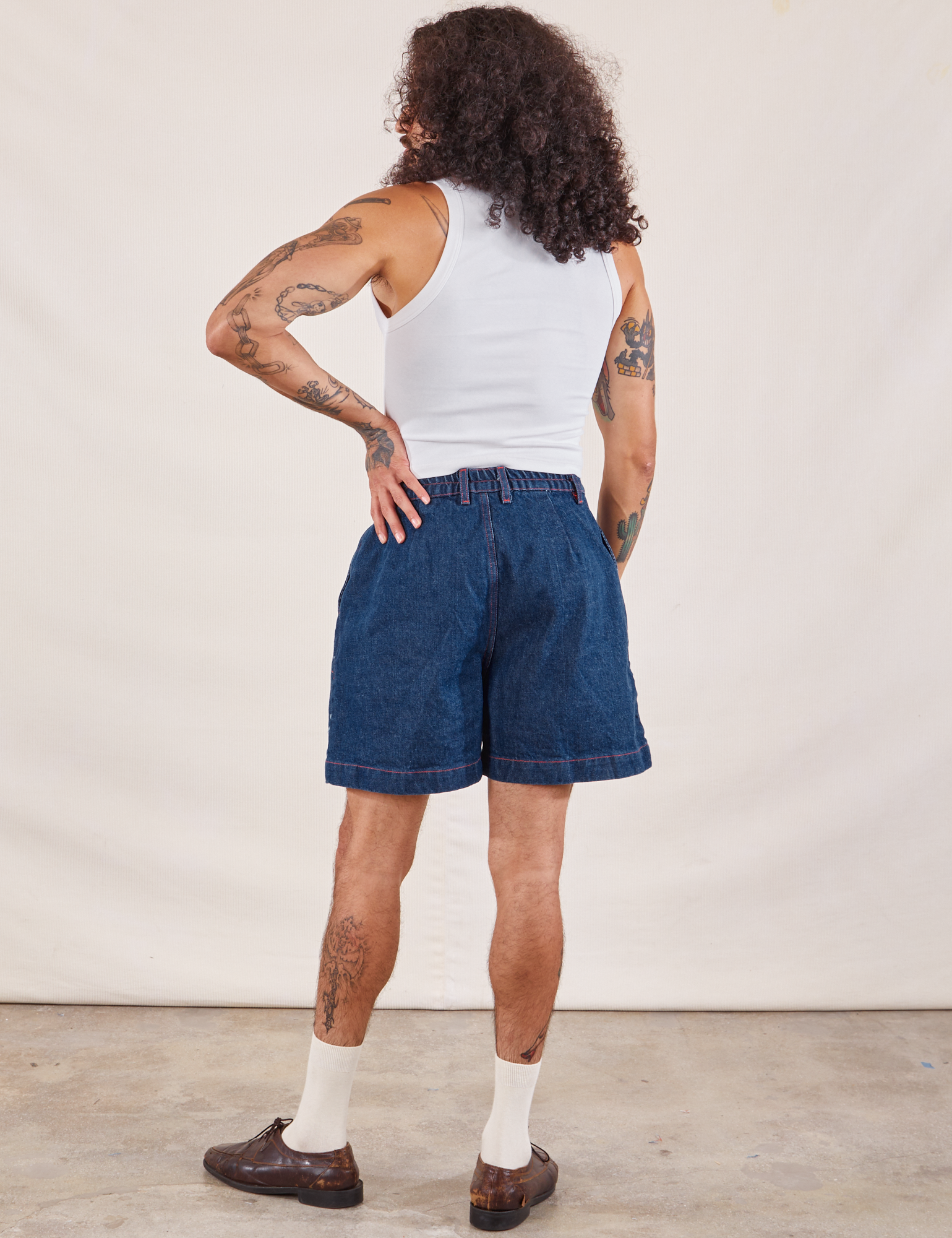 Back view of Denim Trouser Shorts in Dark Wash and Cropped Tank in vintage tee off-white on Jesse