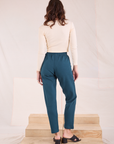 Back view of Easy Pants in Lagoon and vintage tee off-white Long Sleeve V-Neck Tee on Alex