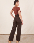 Back view of Western Pants in Espresso Brown paired with fudgesicle brown V-Neck Tee worn by Soraya