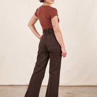 Back view of Western Pants in Espresso Brown paired with fudgesicle brown V-Neck Tee worn by Soraya