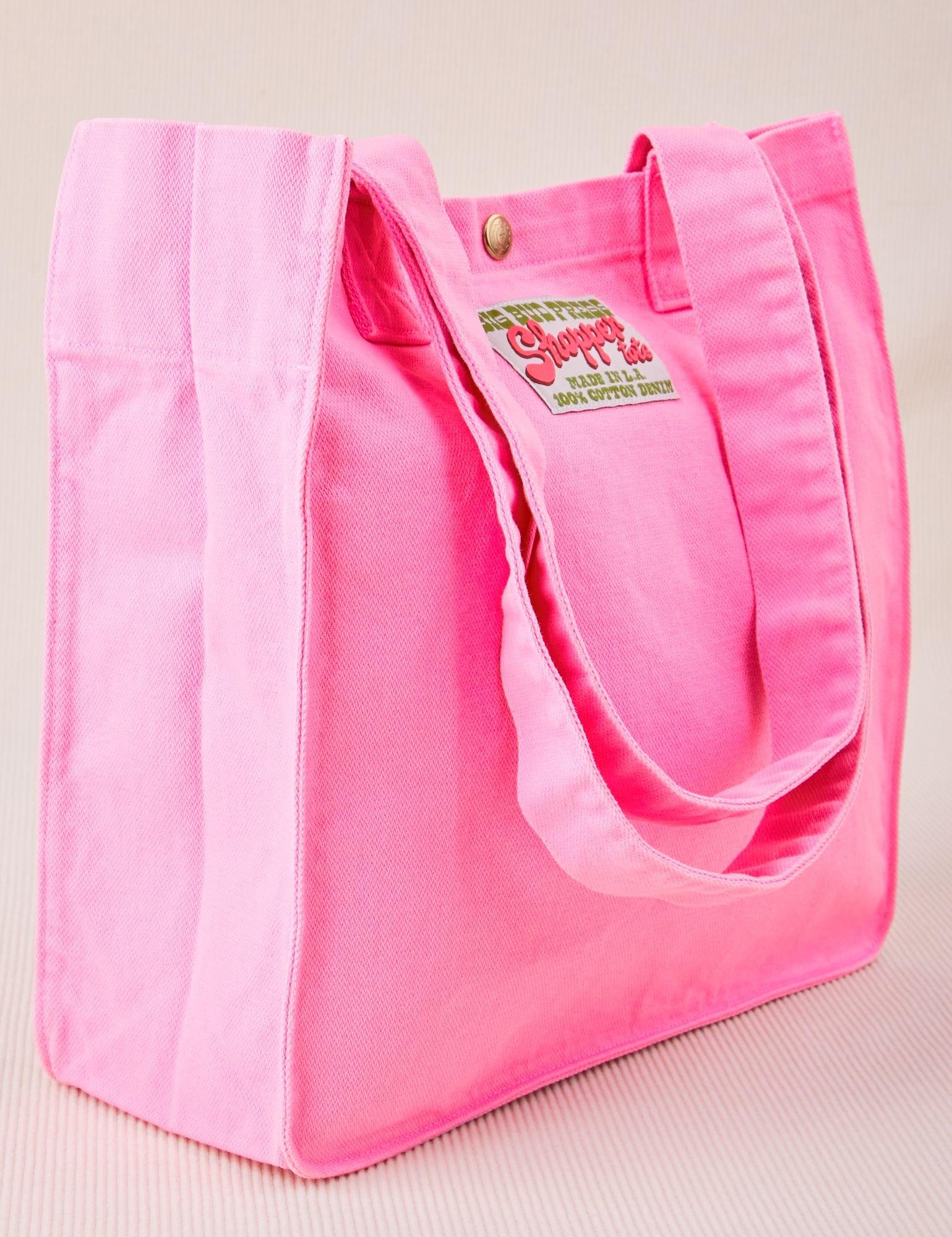 Angled view of Shopper Tote Bag in Bubblegum Pink