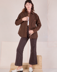 Alex is wearing Overdyed Denim Overshirt in Fudge paired with espresso brown Western Pants