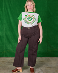 Lish is wearing Lucky Charm Organic Tee tucked into espresso brown Western Pants