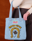 Shopper Tote in Golden Horseshoe worn on Lish's arm