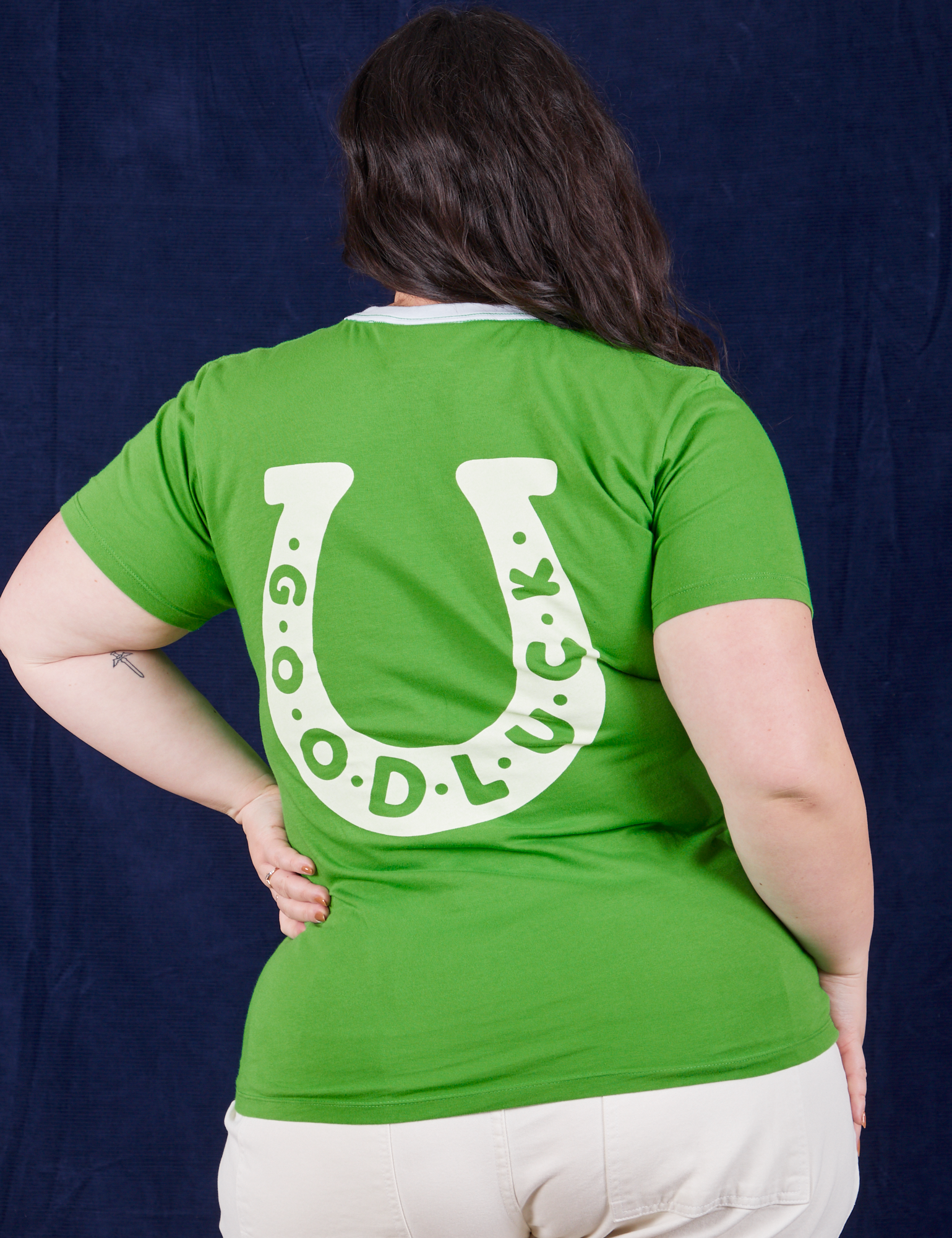Back view of Luck Tee on Ashley. White horseshoe with &#39;good luck&#39;