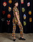 Short Sleeve Jumpsuit in Halloween Masks side view on Alex