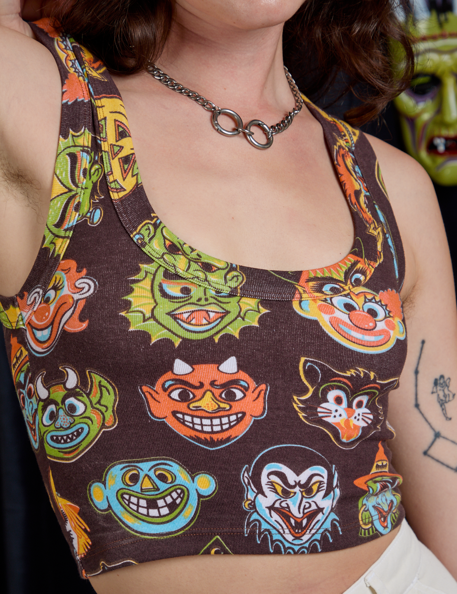 Close up of Cropped Tank Top in Halloween Masks on Alex