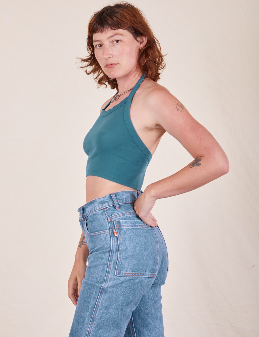 Side view of Halter Top in Marine Blue and light wash Frontier Jeans worn by Alex