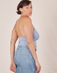 Side view of Halter Top in Periwinkle and light wash Sailor Jeans worn by Tiara