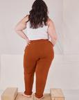 Back view of Rolled Cuff Sweat Pants in Burnt Terracotta and Cropped Tank in vintage tee off-white  on Ashley