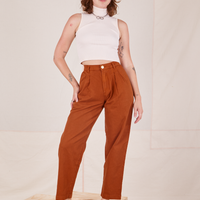 Alex is 5'8" and wearing XXS Heavyweight Trousers in Burnt Terracotta paired with vintage off-white Sleeveless Turtleneck