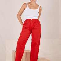 Tiara is 5'4" and wearing S Heavyweight Trousers in Mustang Red paired with vintage off-white Cropped Cami