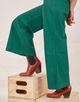 Side pant leg close up of Bell Bottoms in Hunter Green worn by Tiara