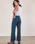 Back view of Western Pants in Lagoon and vintage tee off-white Cropped Tank on Jesse