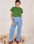 Tiara is wearing Organic Vintage Tee in Lawn Green tucked into light wash Sailor Jeans