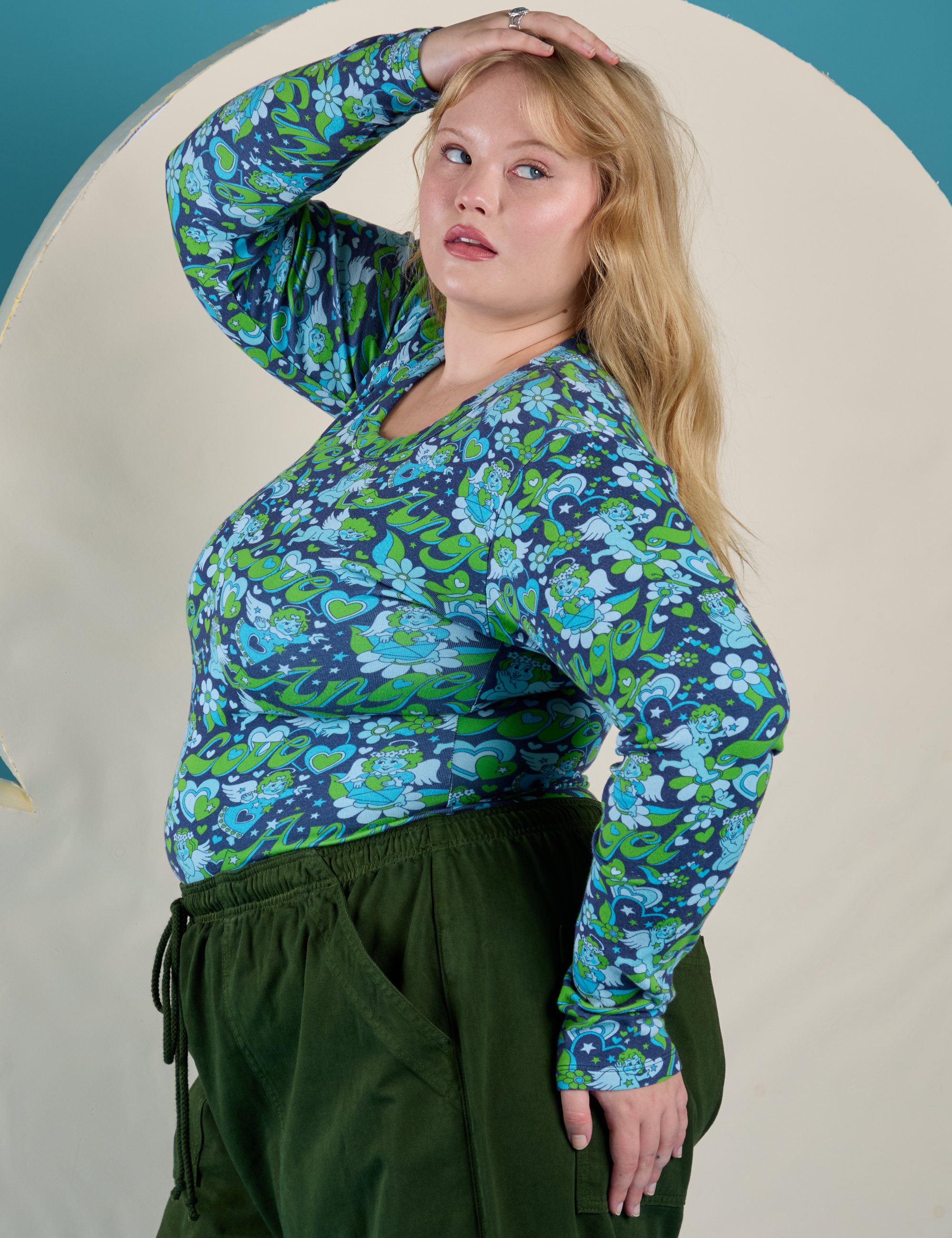 Side view of Long Sleeve Baby Tee in Angel Print on Juliet