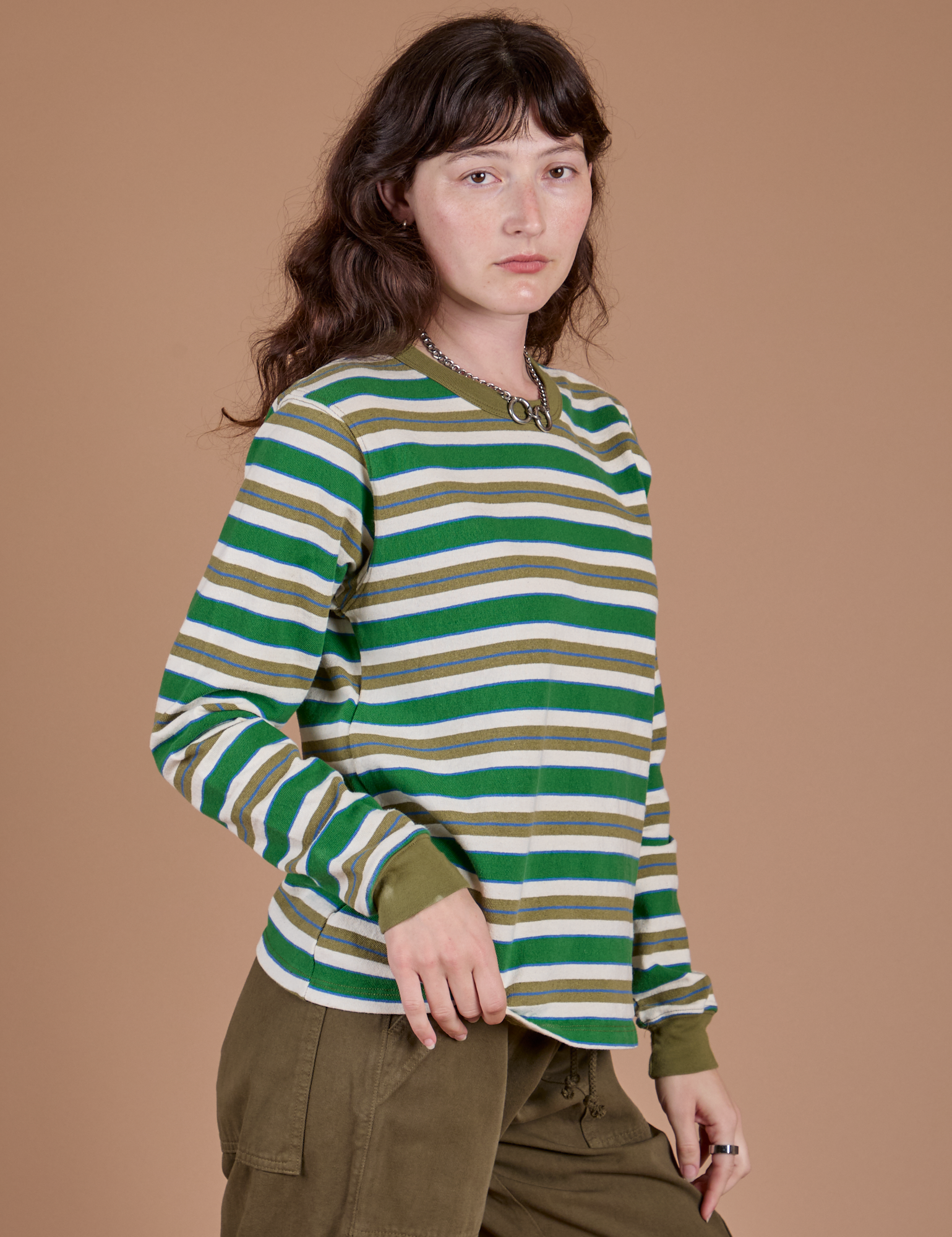 Long Sleeve Striped Burly Tee in Green angled front view on Alex