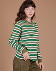 Long Sleeve Striped Burly Tee in Green angled front view on Alex