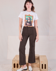 Alex is wearing Masters Organic Tee in Mona Lisa tucked into espresso brown Western Pants