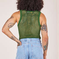 Back view of Mesh Tank Top in Lawn Green and light wash Sailor Jeans worn by Jesse.