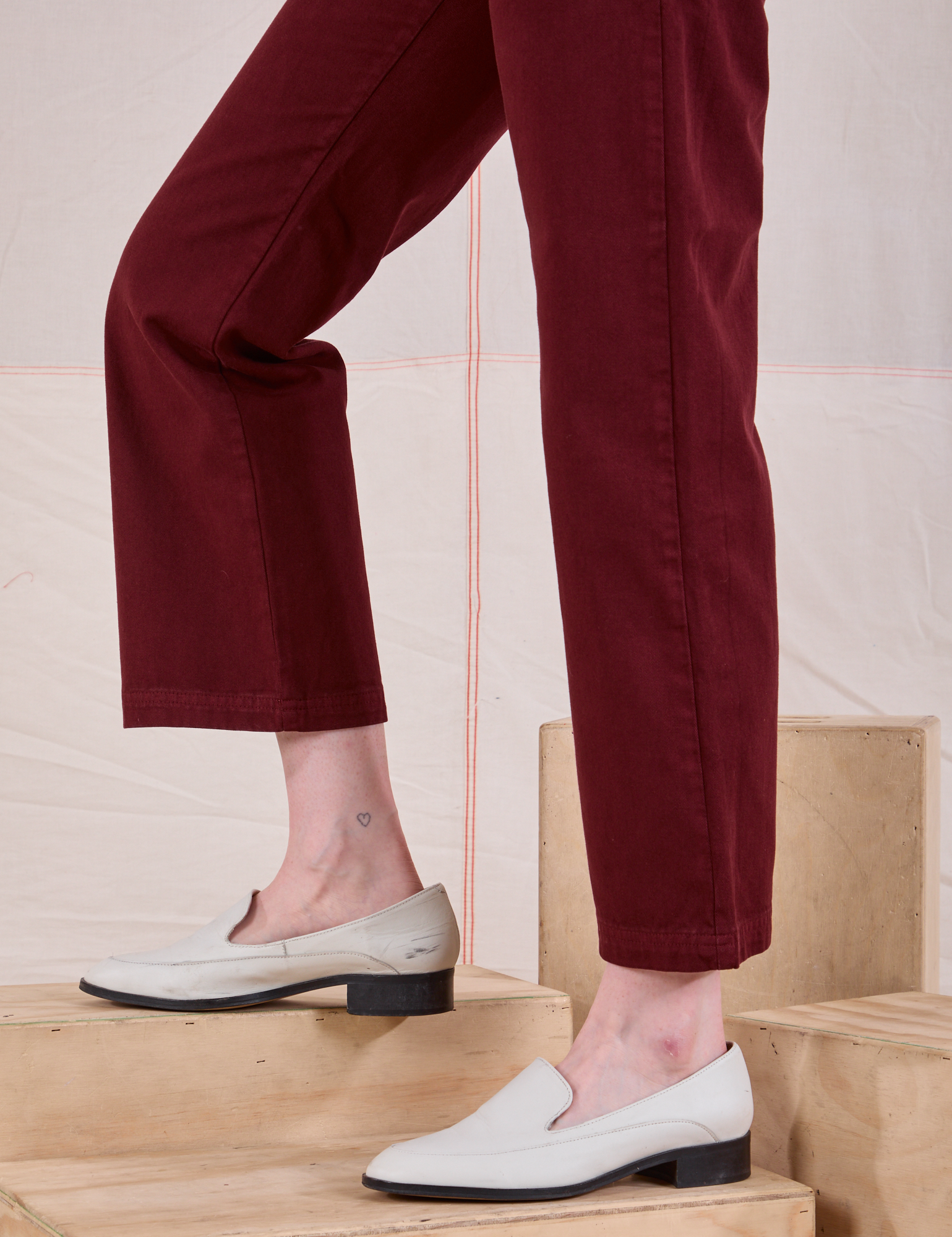 Mid-Rise Work Pants in Red Wine side view pant leg close up on Margaret