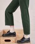 Mid-Rise Work Pants in Swamp Green pant leg close up on Margaret