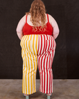 Back view of Western Pants in Ketchup/Mustard Stripes and mustang red Cami on Catie