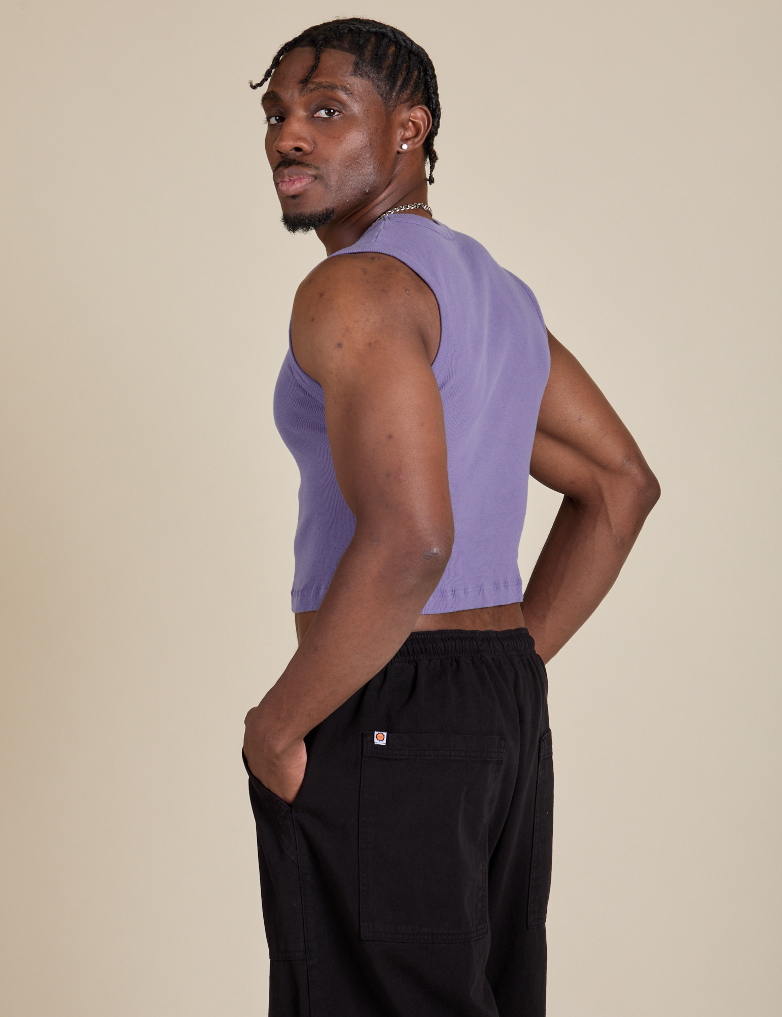 Angled back view of Muscle Tee in Faded Grape on Isaac
