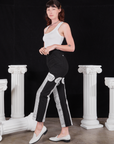 Side view of Column Work Pants in Basic Black and vintage off-white Cropped Tank Top on Alex