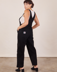 Angled back view of Original Overalls in Mono Black worn by Tiara