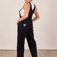 Angled back view of Original Overalls in Mono Black worn by Tiara