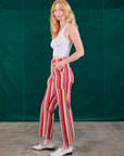 Side view of Stripe Work Pants in Cherry Candy and Cropped Tank in vintage tee off-white on Margaret