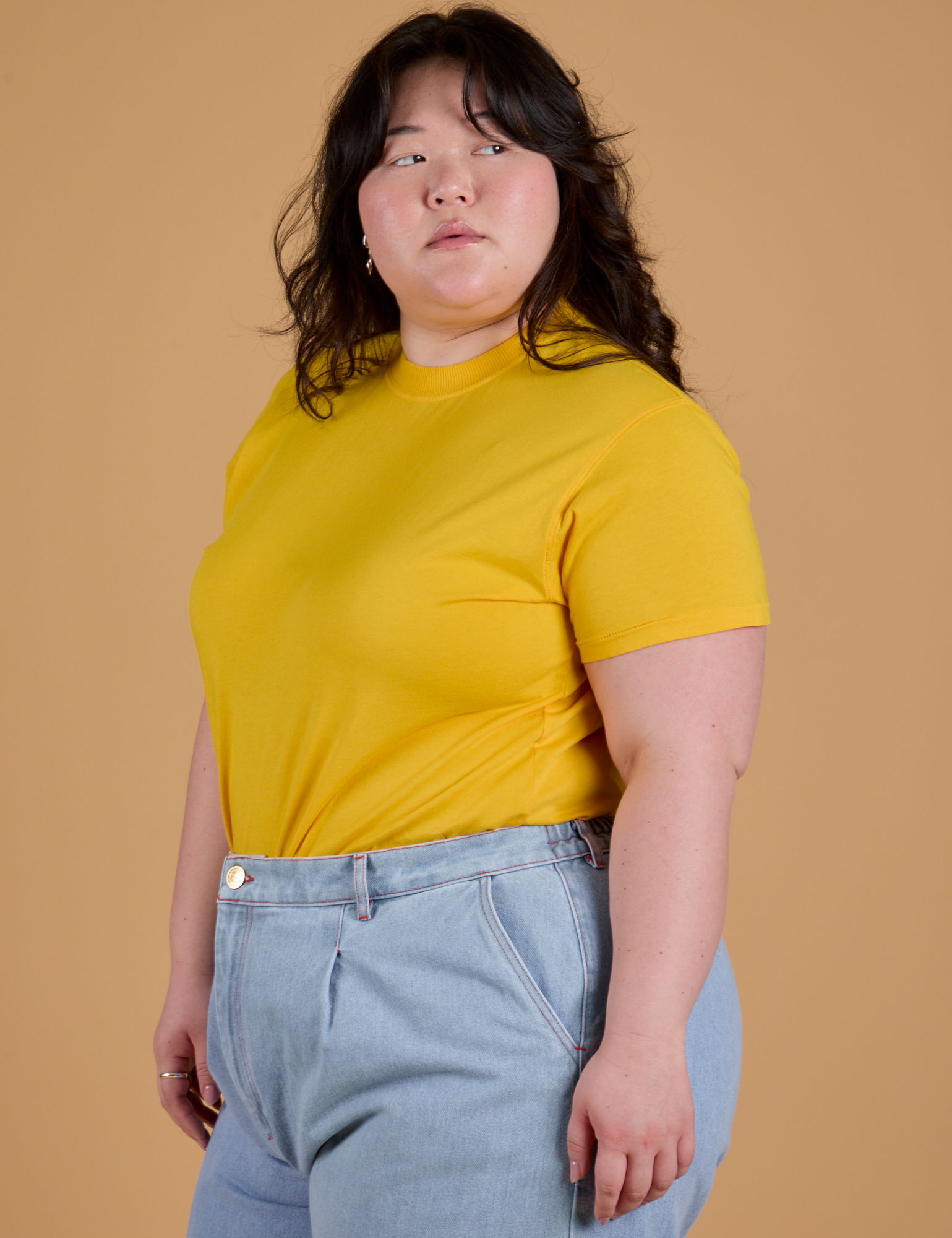 Angled front view of Organic Vintage Tee in Sunshine Yellow on Ashley