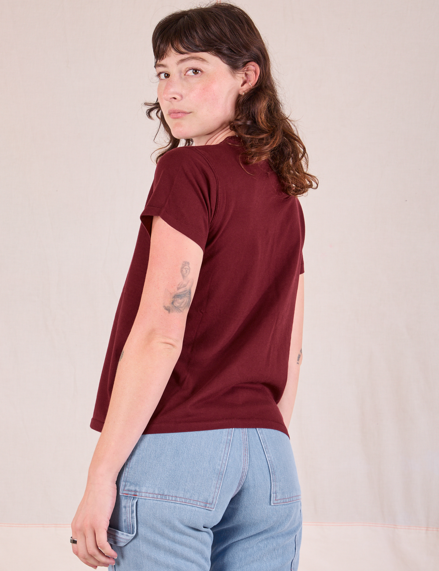 Organic Vintage Tee in Red Wine angled back view on Alex