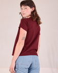 Organic Vintage Tee in Red Wine angled back view on Alex