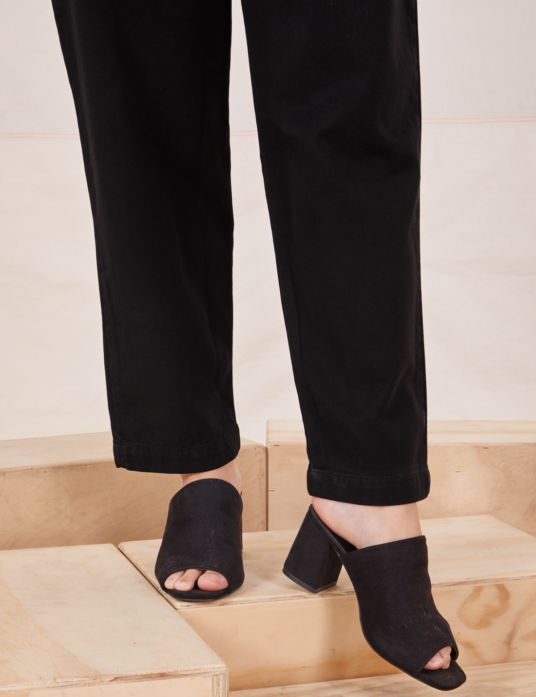 Pant leg close up of Organic Trousers in Basic Black worn by Alex