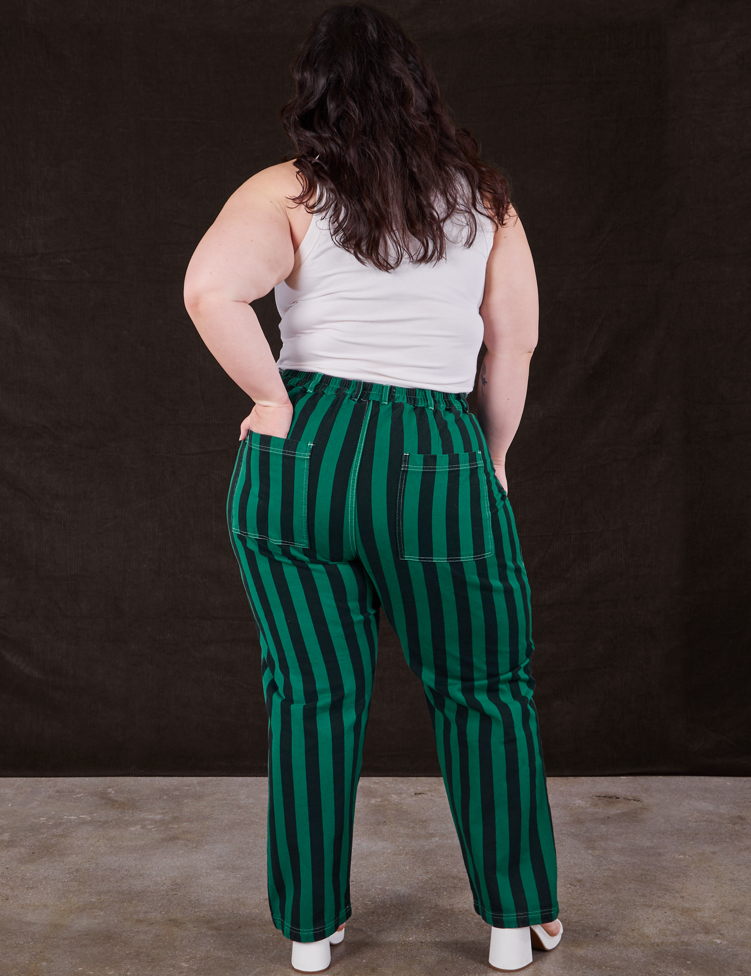Back view of Black Stripe Work Pants in Hunter and vintage off-white Cropped Tank Top on Ashley