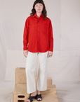 Alex is wearing Twill Overshirt in Mustang Red paired with vintage tee off-white Western Pants