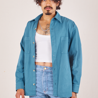 Jesse is wearing Oversize Overshirt in Marine Blue and a vintage off-white Cropped Tank Top underneath