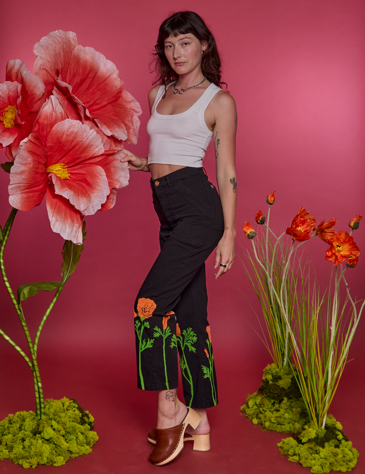 Alex is wearing Paintstamped Work Pants in Poppy and Cropped Tank in Vintage Tee White