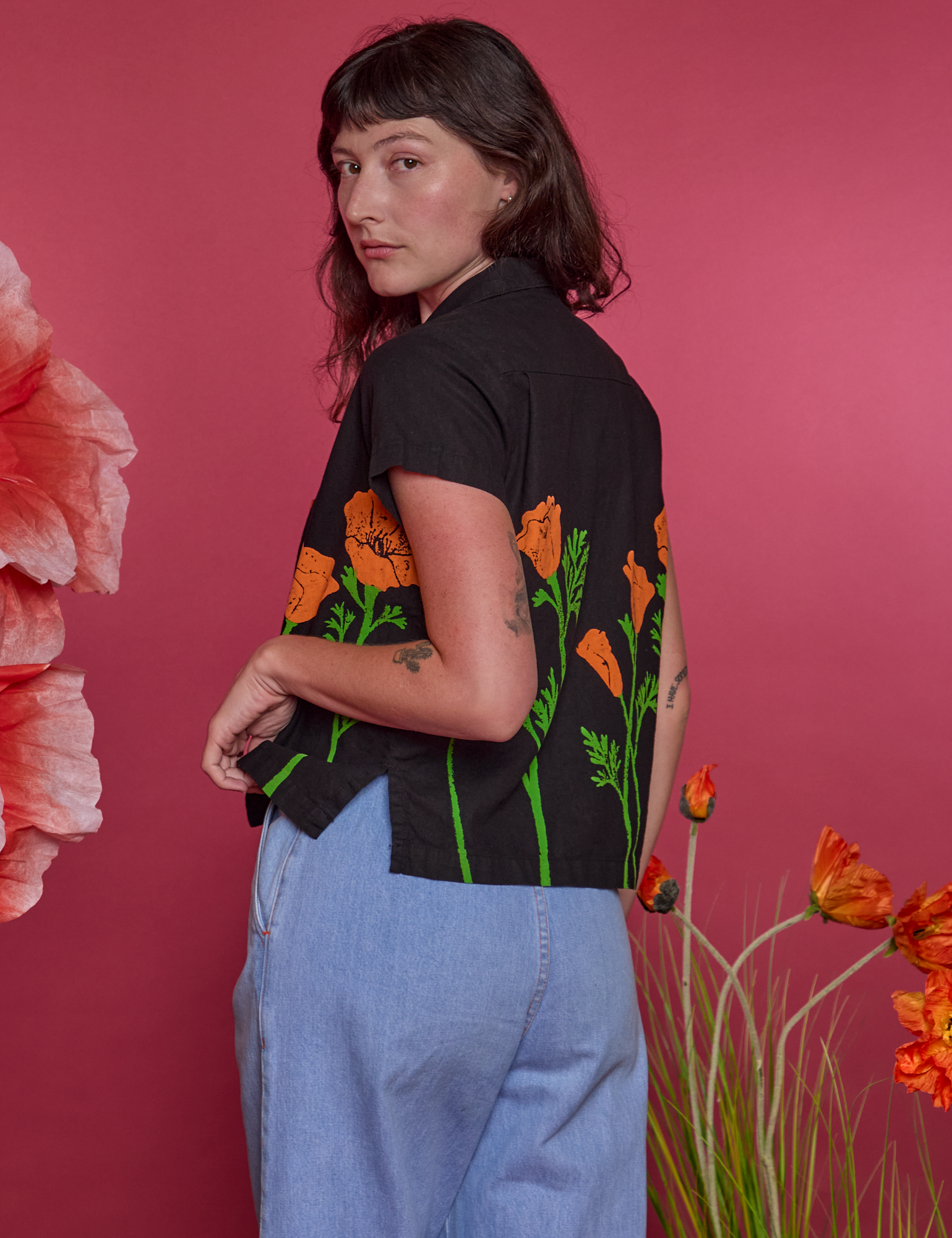 Angled back view of Paintstamped Pantry Button-Up in Poppy on Alex