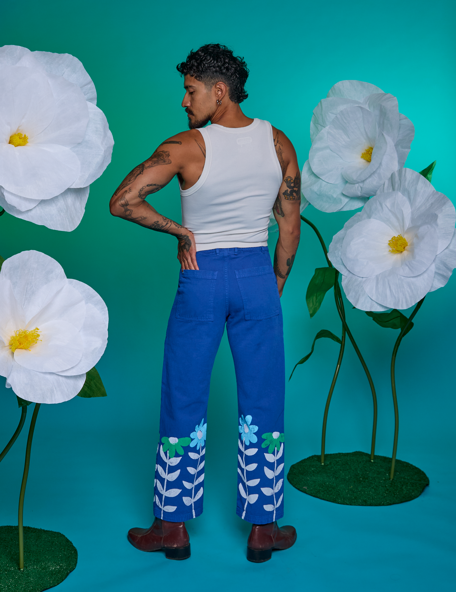 Back view of Paintstamped Work Pants in Daisy and Cropped Tank in Vintage Tee White on Jesse