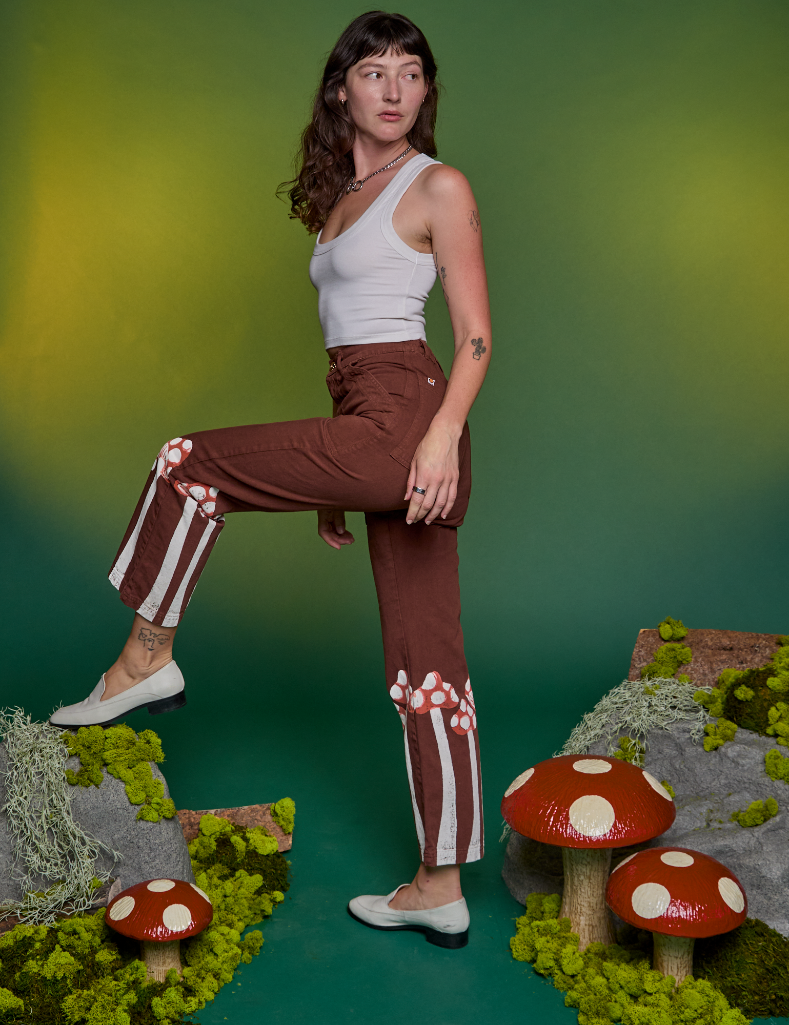 Side view of Paintstamped Work Pants in Mushroom and Cropped Tank in Vintage Tee White on Alex