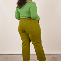 Work Pants in Olive Green back view on Morgan wearing bright olive Long Sleeve V-Neck Tee