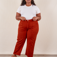 Morgan is 5'5" and wearing Petite 1XL Work Pants in Paprika paired with a vintage off-white Baby Tee